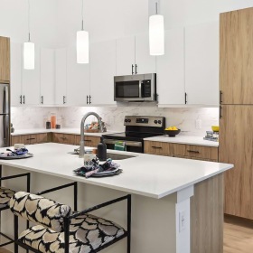 Spacious Kitchen kitchen with light wood cabinets and island