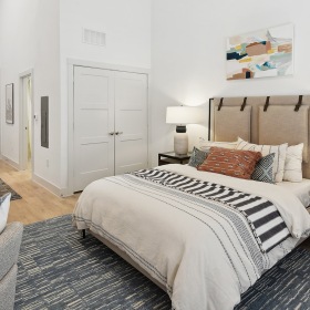 Bedroom Space bedroom with wood-like flooring and storage