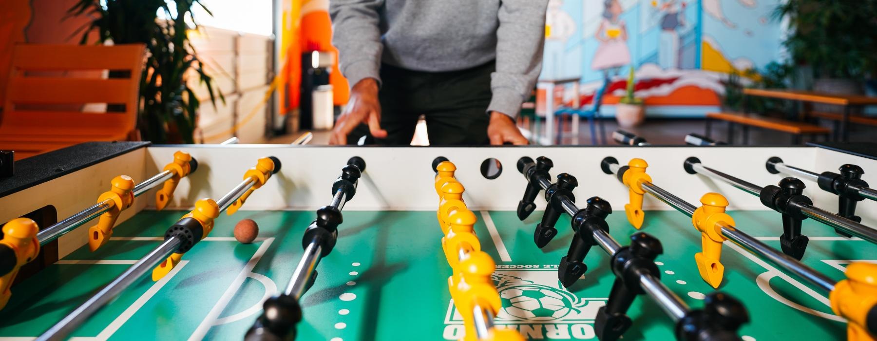 a person playing foosball